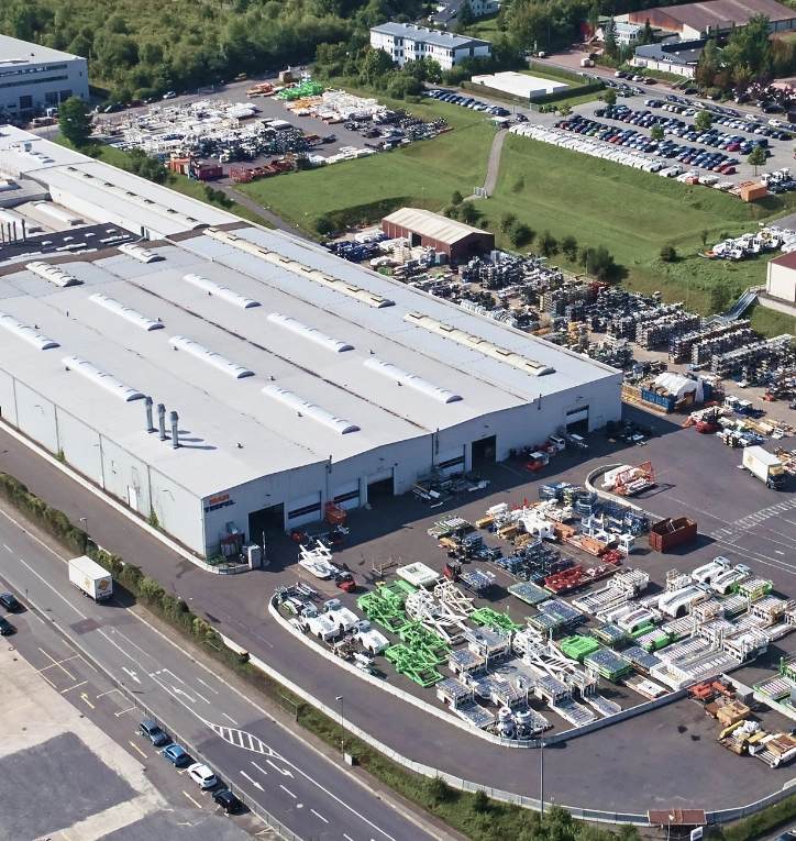 Aerial view of industrial production facility and outdoor equipment storage