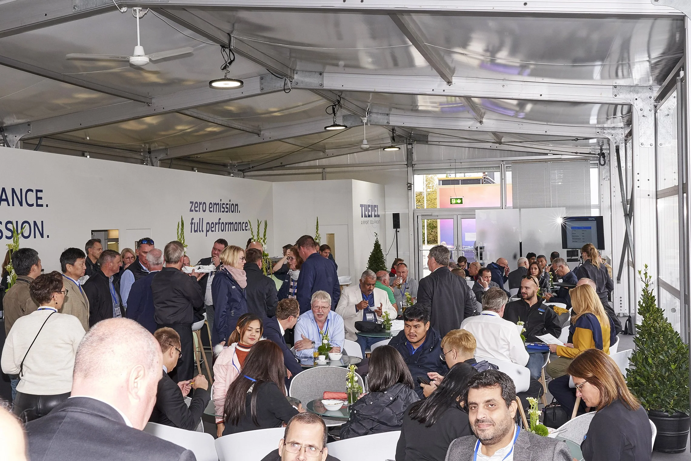 Large group of visitors gathered inside a TREPEL hospitality tent during Inter Airport 2019