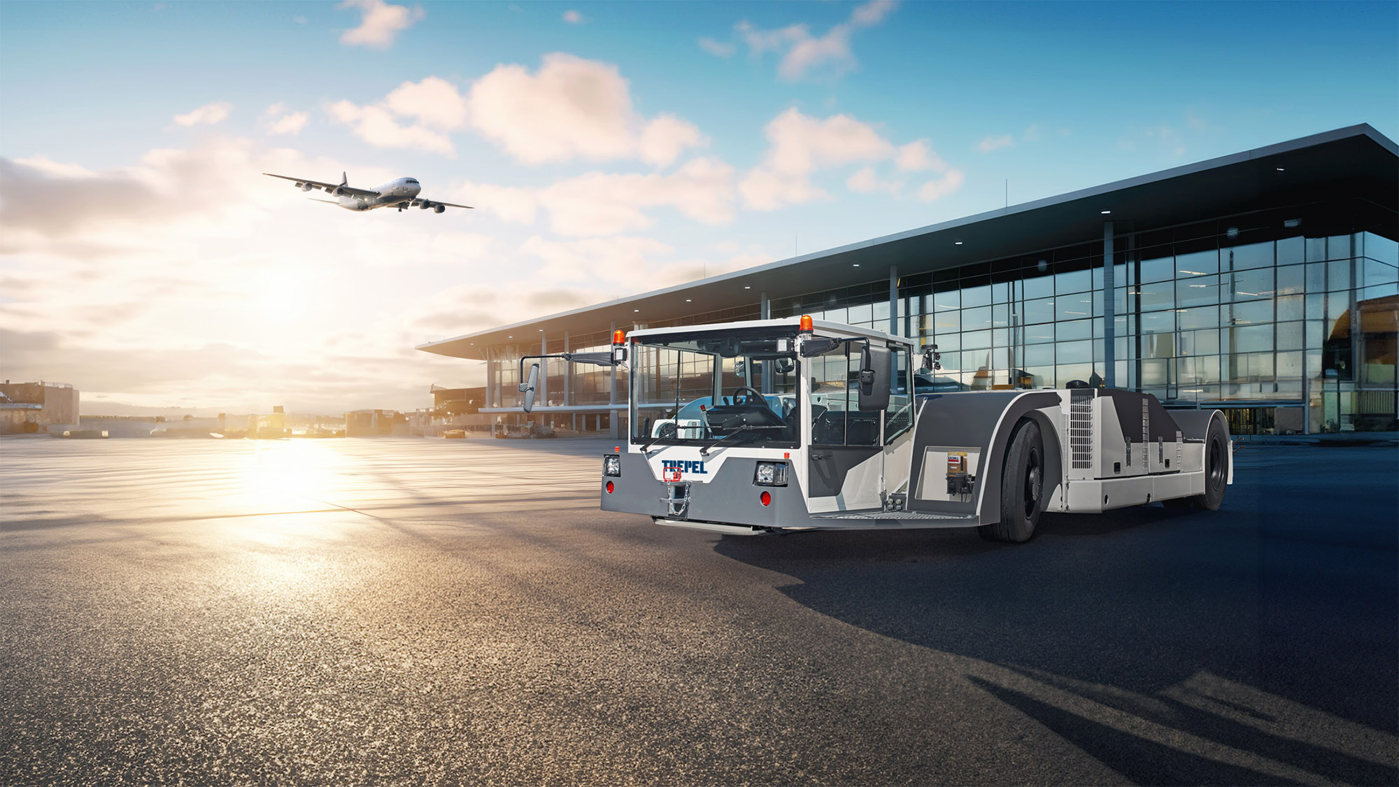 Flugzeugschlepper CHARGER 380 e auf dem Vorfeld bei Sonnenaufgang